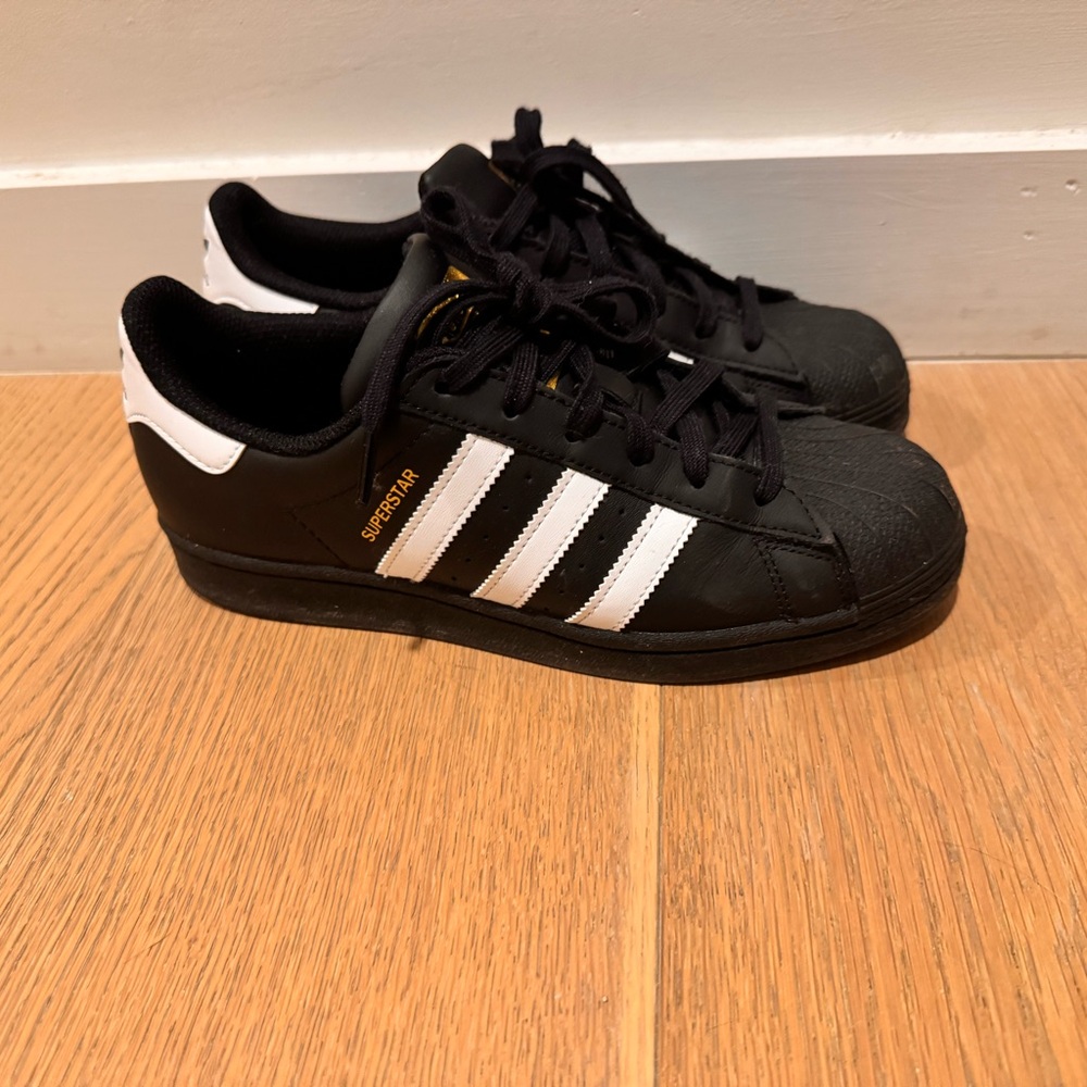 Adidas Superstar sneakers in black with white strips